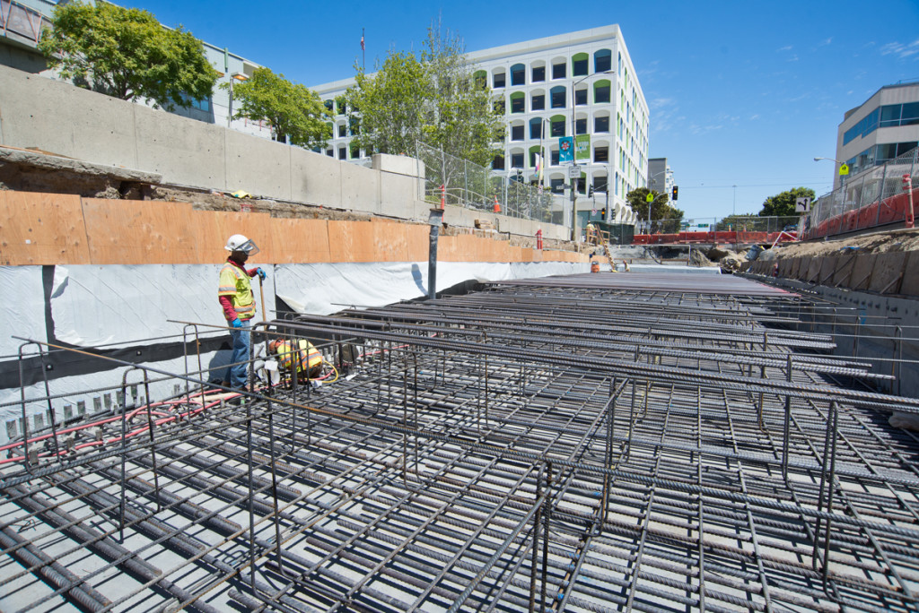 Workers assembling the rebar cage for a portion of the roof slab at the southeast portion of the work site.